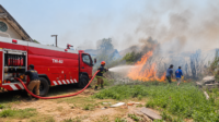 Firefighters Battling a Grassland Blaze